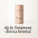 Alg In Treatment detoxande algkur från Green Heads i rosa cylinderförpackning på vitt underlag.