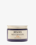 Bruns silvermask nummer 24 återfuktar, ger glans och neutraliserar gula toner i blonda hår. En blå burk med ett silvrigt lock.